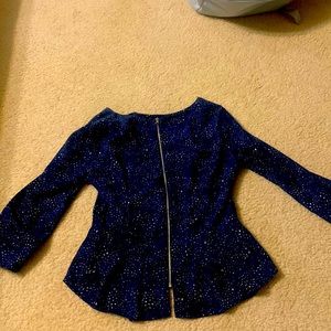 This is a zip up shirt it is a size S and it is from Forever 21.